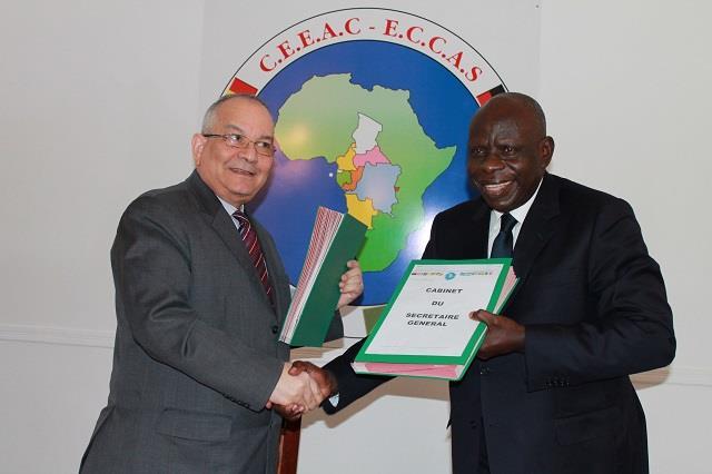 © 2015 AU-IBAR. Mr. Ahmad ALLAM-MI, General Secretary of ECCAS (at left) and Mr. Emile Essema, Executive Secretary of COREP(at right), exchanging of the signed documents and mutual congratulations.